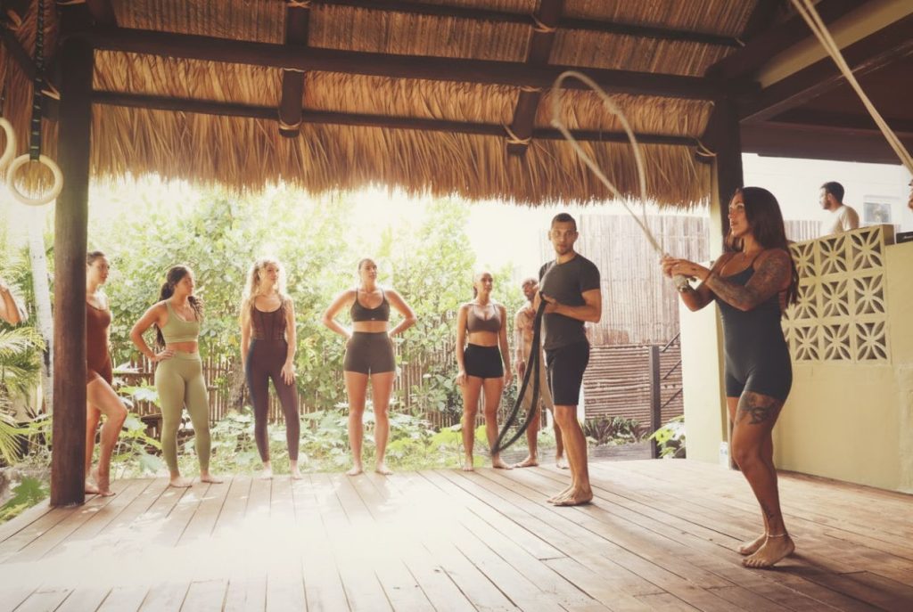 Group fitness training with battle ropes at SILA Miami, a third space fitness and longevity community in Miami, FL